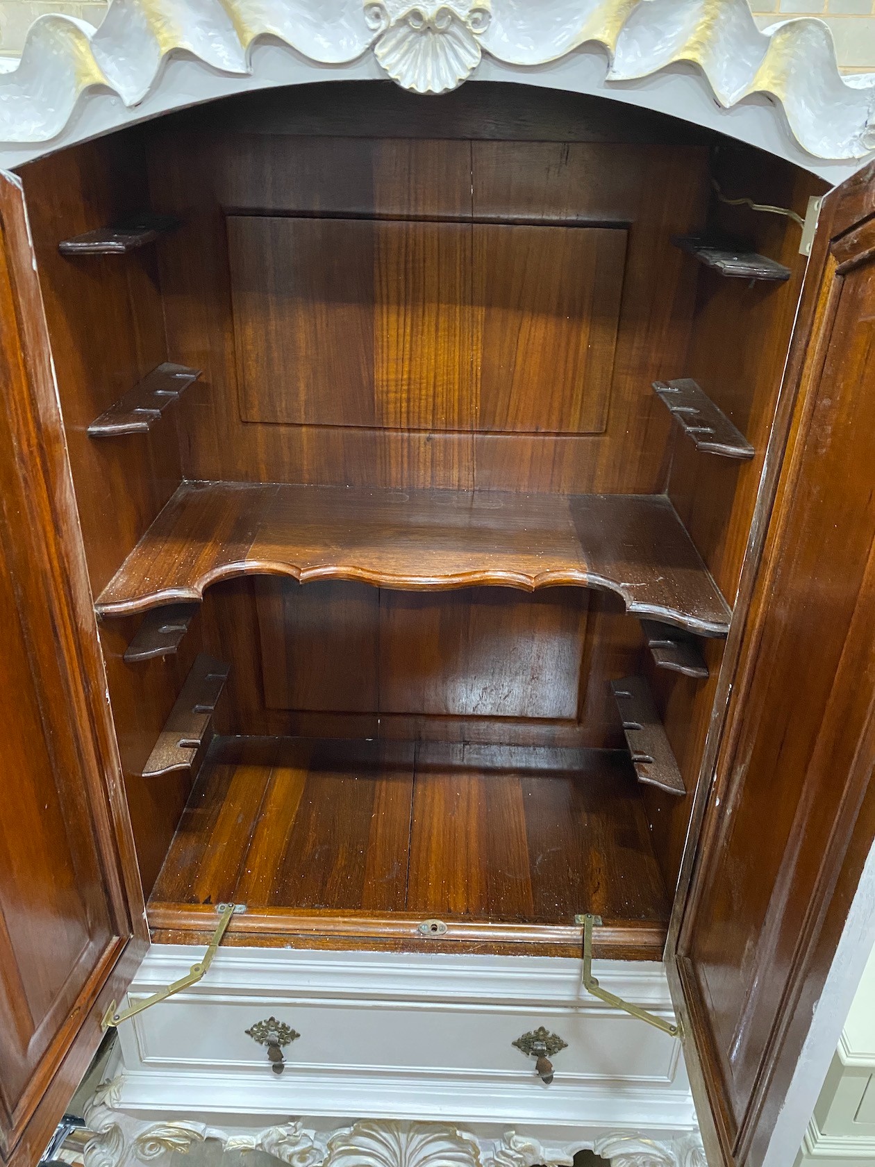A French grey painted hardwood cocktail cabinet, with parcel gilt decoration, width 75cm height 175cm